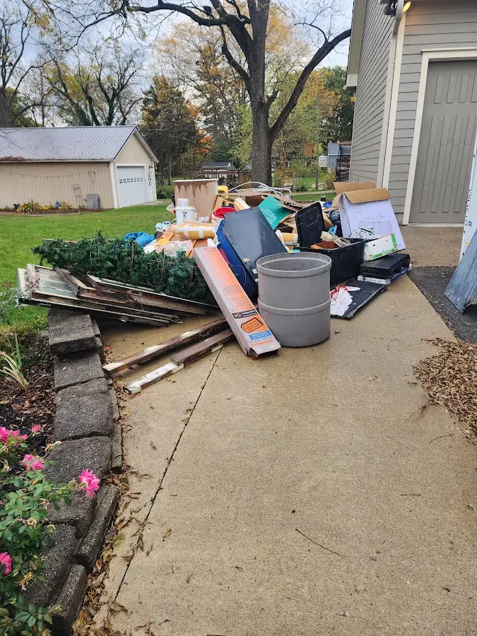 Dumpster being loaded with debris for Roofing Dumpster Rental in Union